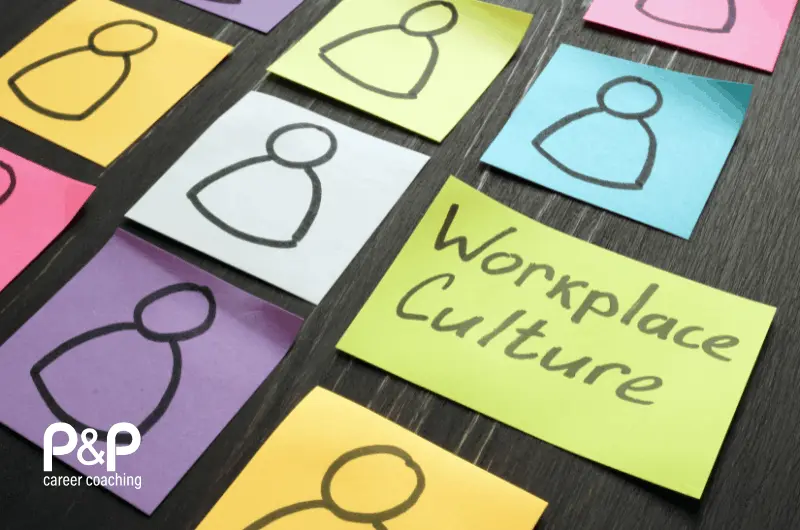 Sticky notes on a table representing workplace culture and employee experience, featuring simple people icons in different colours alongside a handwritten note reading “Workplace Culture,” with Parent & Professional (P&P) branding in the corner.